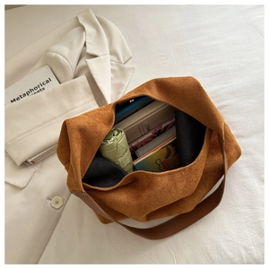 Detail view of spacious caramel tote bag showing interior storage capacity and suede texture