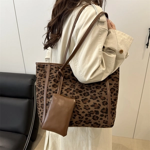 Chic leopard print tote bag with brown leather straps and matching mini pouch for women