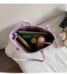 Top view of spacious purple tote bag interior showing large storage capacity and zipper