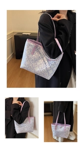 Detail of the woven purple geometric pattern and floral accents on a large tote bag