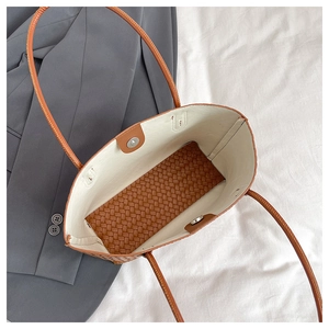 Brown woven leather tote bag with large capacity and magnetic buckle for daily commute