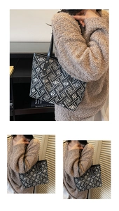 Detail view of ethnic style tote bag with geometric floral patterns and black straps