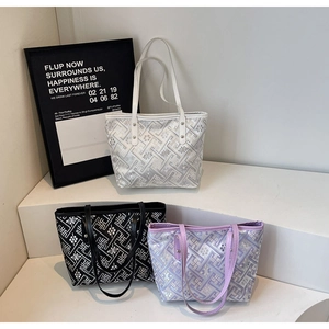 Detailed display of vintage pattern tote bags in white, black and lilac colors