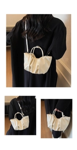 Detail of pleated cream leather bag with round handle and shoulder strap in multi-angle view