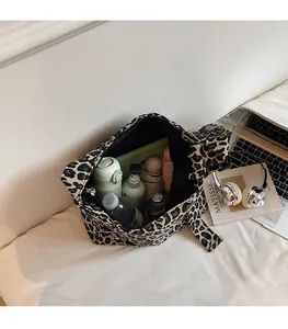 Interior view of large leopard print canvas tote bag showing spacious capacity for items