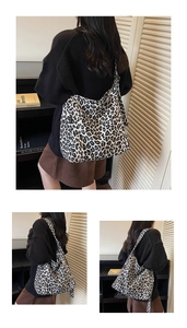 Detailed close-up of a large capacity canvas tote bag with black and white leopard print