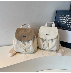 Detailed comparison of two nylon mini backpacks featuring flap drawstring and brand label