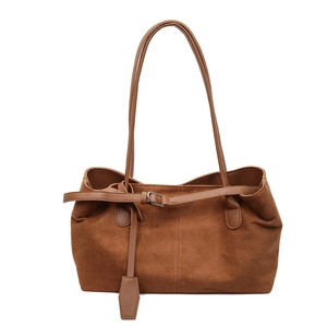 Deep brown matte suede tote bag with slim shoulder straps for a retro minimalist look