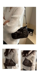 Detailed view of dark brown patent leather shoulder bag with decorative silver rivets