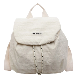 Minimalist beige nylon backpack with drawstring closure and large flap top for daily travel