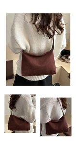 Detail of retro chocolate brown suede tote bag with zipper and fine corduroy texture
