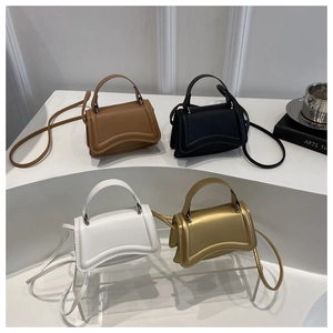 Miniature hourglass leather handbags in brown, black, white and gold with shoulder straps