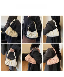 Collage of pleated underarm bags in ivory, pink and champagne gold with metal logo