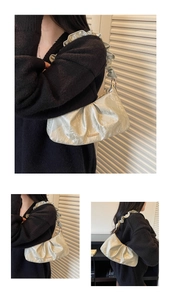 Detail of metallic pleated croissant bag showing champagne gold finish and scrunched strap