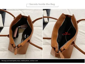 Detail view of large brown tote bag interior compartment showing ample storage space