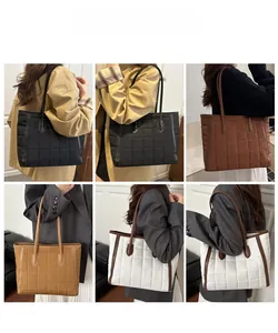 Quilted tote bag in black, coffee, khaki and white shown as shoulder bags on models