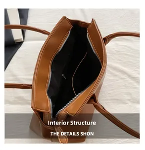 Internal structure of the retro brown tote bag showing zipper pockets and lining