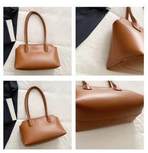 Detail view of caramel brown tote bag with smooth texture and sturdy shoulder straps