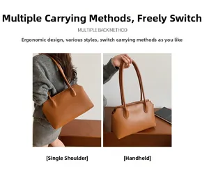 Brown leather tote bag detail showing both shoulder and hand-carry usage options