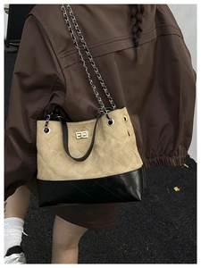 Quilted bucket bag detail showing khaki suede and black leather patchwork design