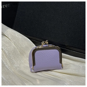 Detail of lavender pebble leather mini pouch with vintage gold metal clasp