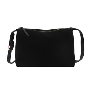 Minimalist black matte shoulder bag with smooth leather trim and metal zipper detail