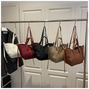 Detail showing various colors and lychee texture of large capacity tote bags