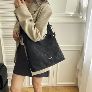 Minimalist black matte leather tote bag with a small pouch for women daily commute