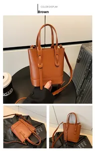 Detailed view of brown PU leather bucket bag with adjustable straps and dual handles