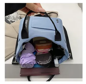 Interior view of the light blue quilted lunch bag showing spacious storage for daily items