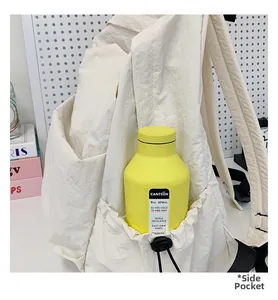 Detail of backpack side pocket with elastic drawstring for securing water bottles