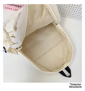 Interior structure of off-white large capacity nylon backpack showing spacious main compartment