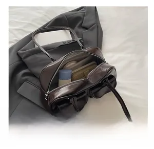 Detail view of large brown shoulder bag interior showing spacious storage capacity