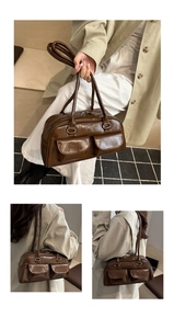 Detailed view of brown patent leather shoulder bag with front pockets and top handles