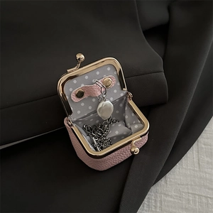Pink litchi leather jewelry pouch with gold clasp and pearl necklace inside