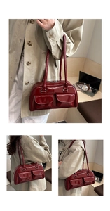 Macro view of burgundy glossy patent leather texture and symmetrical front pocket details