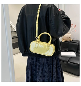 Fashionable pale yellow PVC jelly bag in candy color shown as a stylish crossbody bag