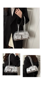 Detail of silver metallic handbag featuring dual flap pockets and glossy finish