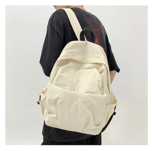 Side view of cream large nylon backpack with multiple pockets for daily commuting