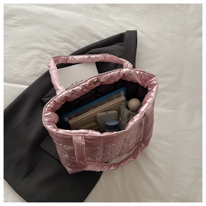 Spacious pink quilted tote bag with metallic finish showing high-capacity interior storage