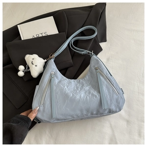 Light blue pleated tote bag with double zippers and cute white cloud pendant detail