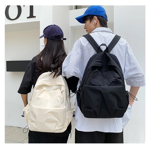 Rear view of minimalist large-capacity nylon backpacks in black and beige on models