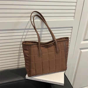 Chic brown quilted tote bag for women with leather handles for stylish office commuting