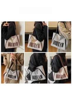 Detail of large canvas tote bag with HOORYA lettering in various styling angles