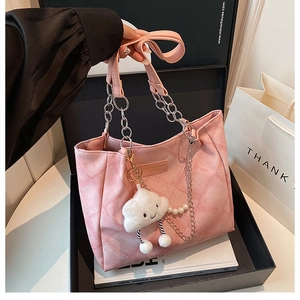 Pink quilted tote bag with silver chain strap and plush cloud charm detail