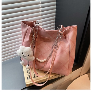 Pink quilted tote bag with silver chain, pearl handle and plush cloud charm detail