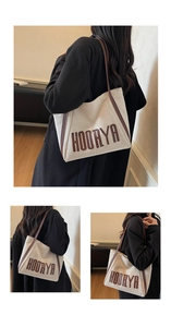 Detail shots of canvas tote bag with brown leather straps and HOORYA lettering