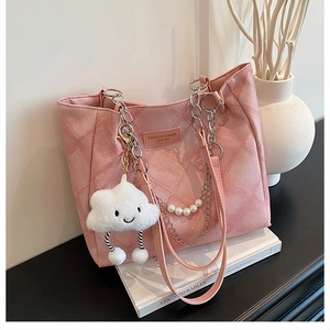 Pink quilted tote bag detail with pearl chain, metal strap and a cute cloud charm