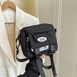 Japanese style black nylon messenger bag with buckle closure and adjustable strap