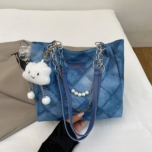 Blue denim quilted tote bag with silver chain, pearls and cloud pendant accessory